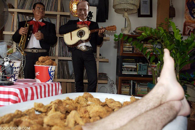  Bogus Bob plays guitar with his trio